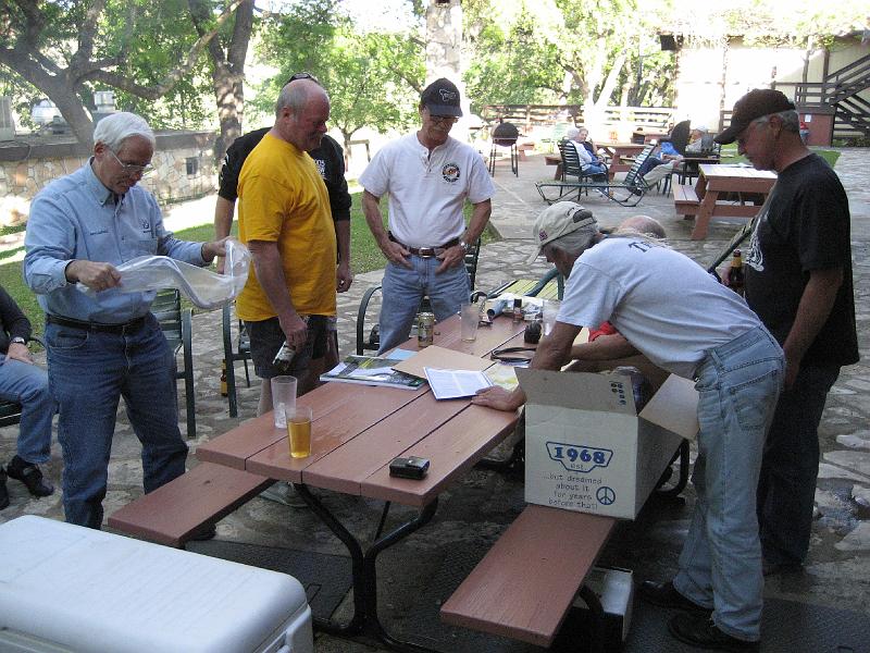 Mike Poteet donating parts for the raffle bike.JPG